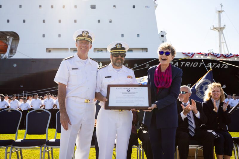 (Left to right) Admiral Francis McDonald, Captain Michael Campbell, and Admiral Ann Phillips with the delivery certificate.