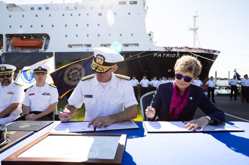 (Left to right) Admiral Francis McDonald and Admiral Ann Phillips sign the delivery certificate. 