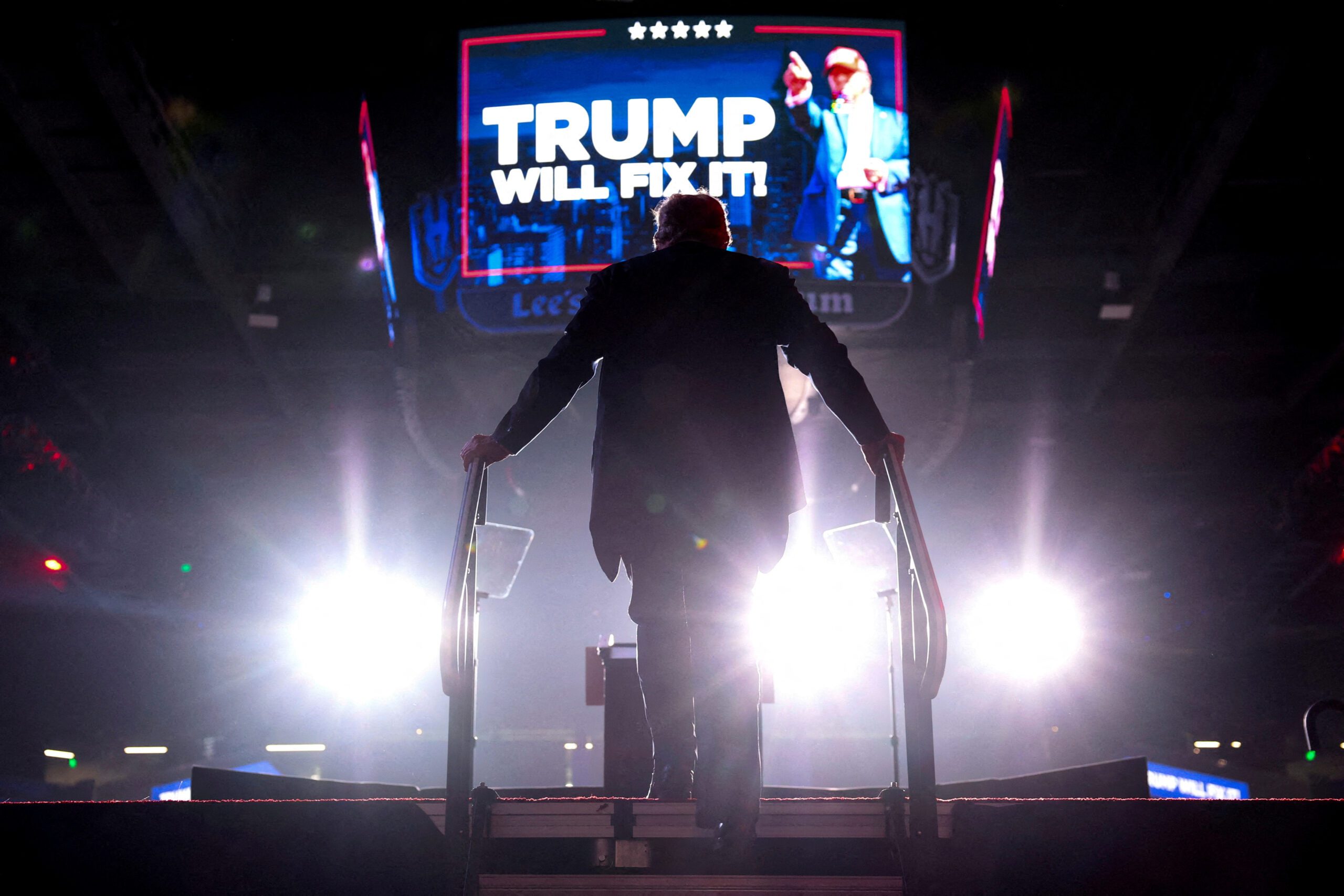 FILE PHOTO: Republican presidential nominee and former U.S. President Donald Trump gets on stage to deliver remarks during a rally at Lee's Family Forum in Henderson