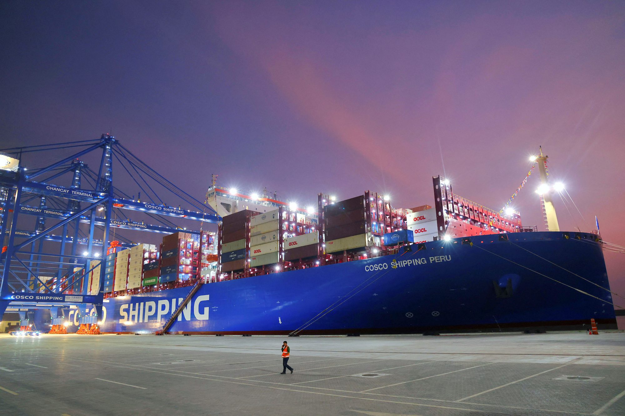 A man walks at China's state-owned Cosco Shipping Chancay port inaugurated during the APEC Summit, in Chancay, Peru, November 14, 2024.