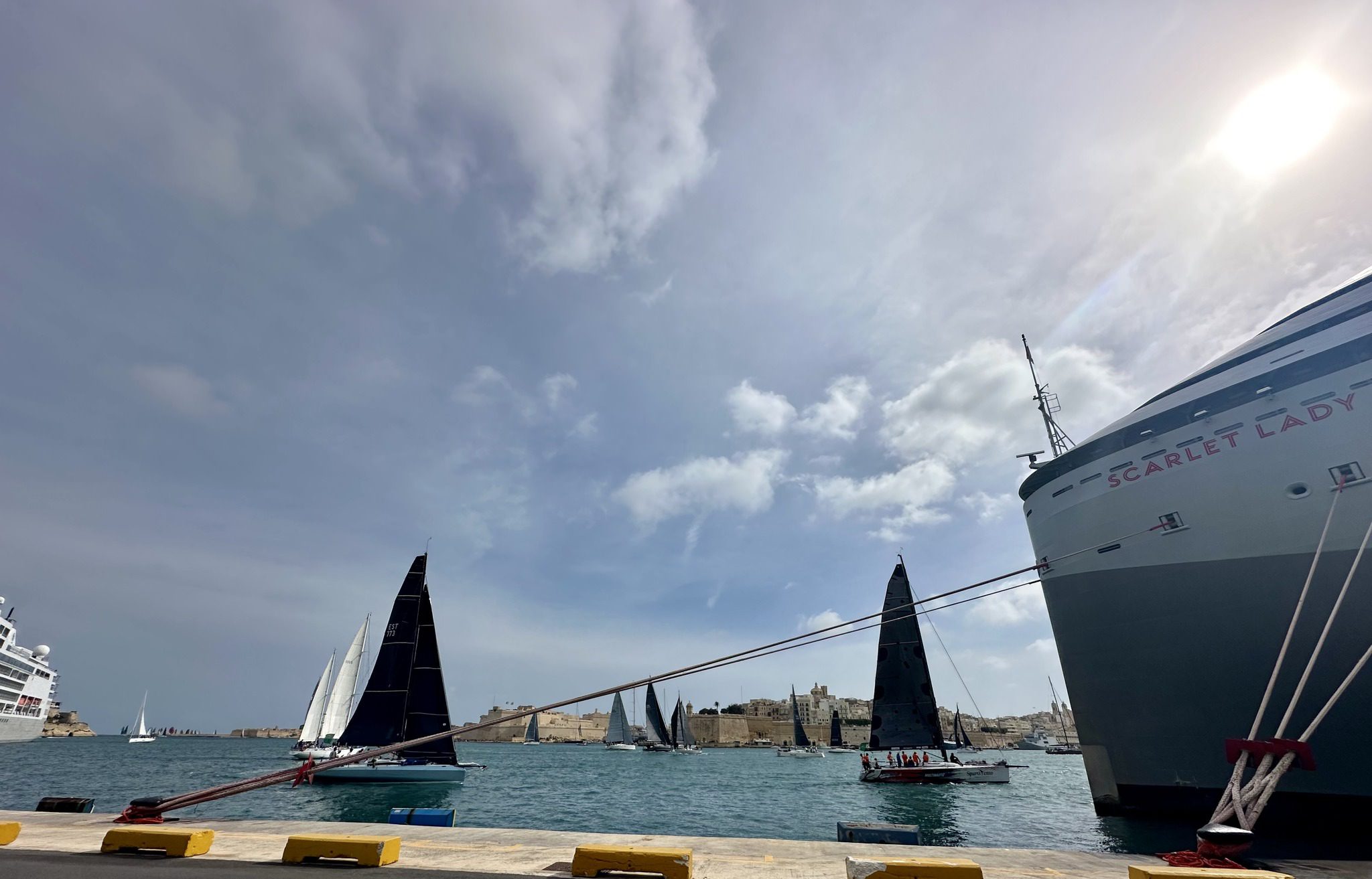 Rolex sailing race yachts under sloudy sky