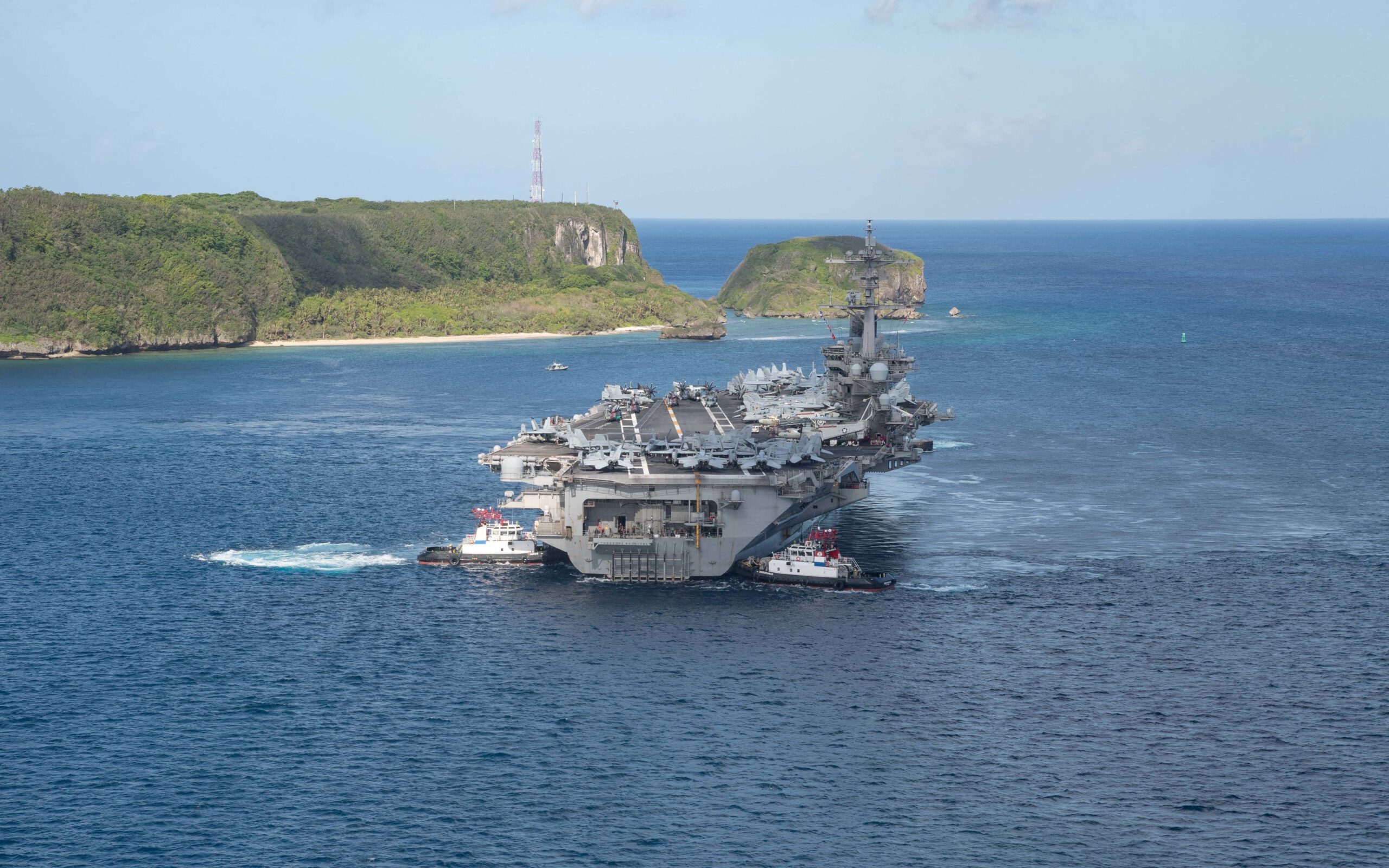 The U.S. Navy aircraft carrier USS Theodore Roosevelt departs following an extended visit in the midst of a coronavirus disease outbreak in Guam. Picture taken May 21, 2020. U.S. Navy/Mass Communication Specialist Seaman Kaylianna Genier.