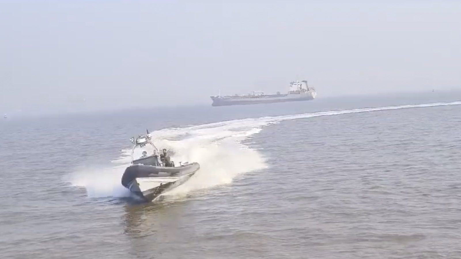 A screenshot from video showing an Indian naval boat colliding with a passenger ferry