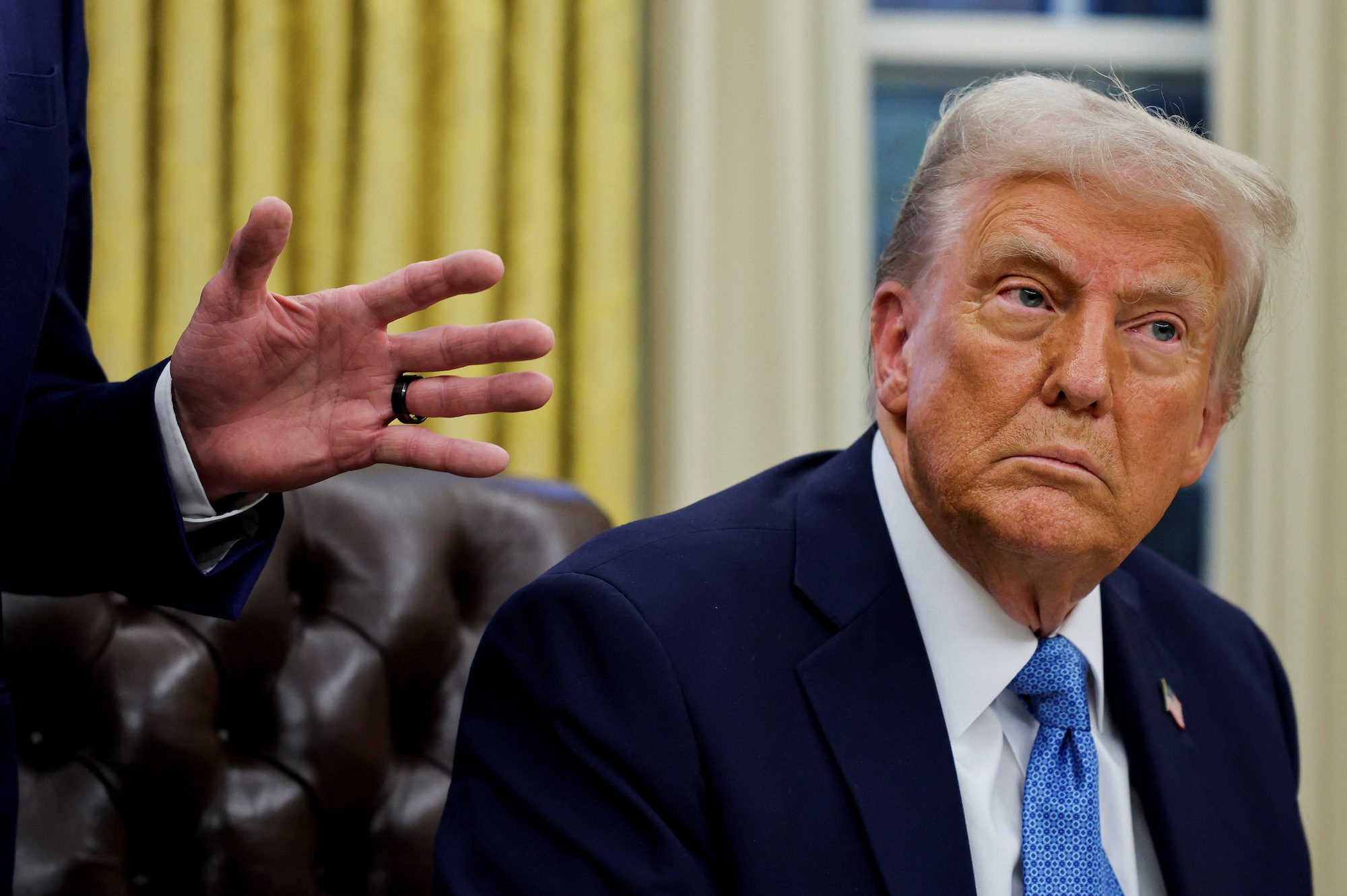 U.S. President Donald Trump looks on, on the day he signs an executive order in the Oval Office at the White House in Washington