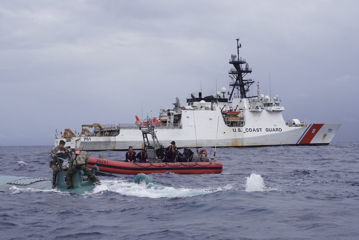 Members of the Coast Guard Cutter Waesche (WMSL-751) law enforcement boarding team inspect a self-propelled semi-submersible (SPSS) in international waters of the Eastern Pacific Ocean