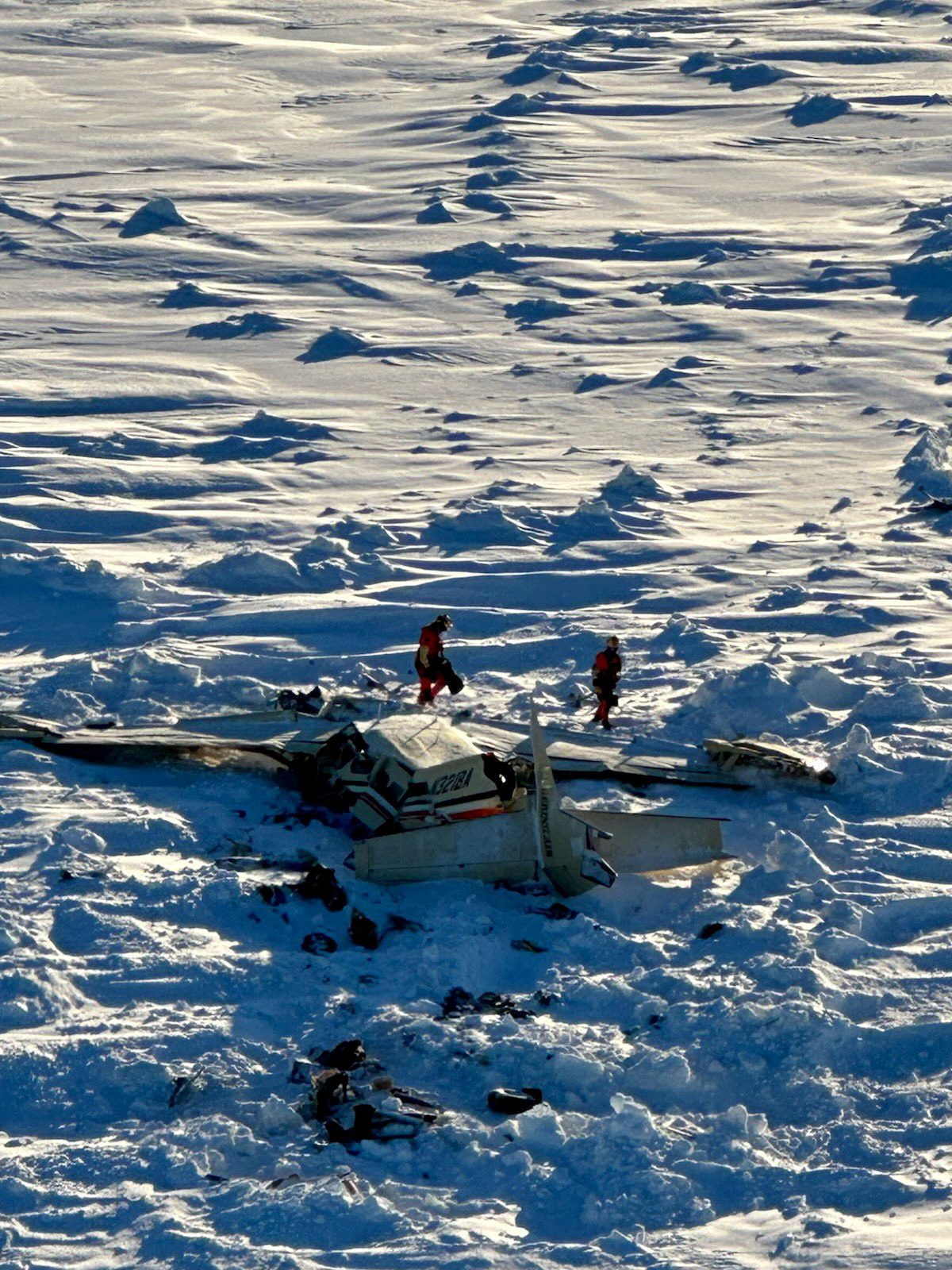 Authorities inspect the wreckage of the Cessna 208B Grand Caravan aircraft operated by Bering Air, near Nome.U.S. Coast Guard/Handout via REUTERS