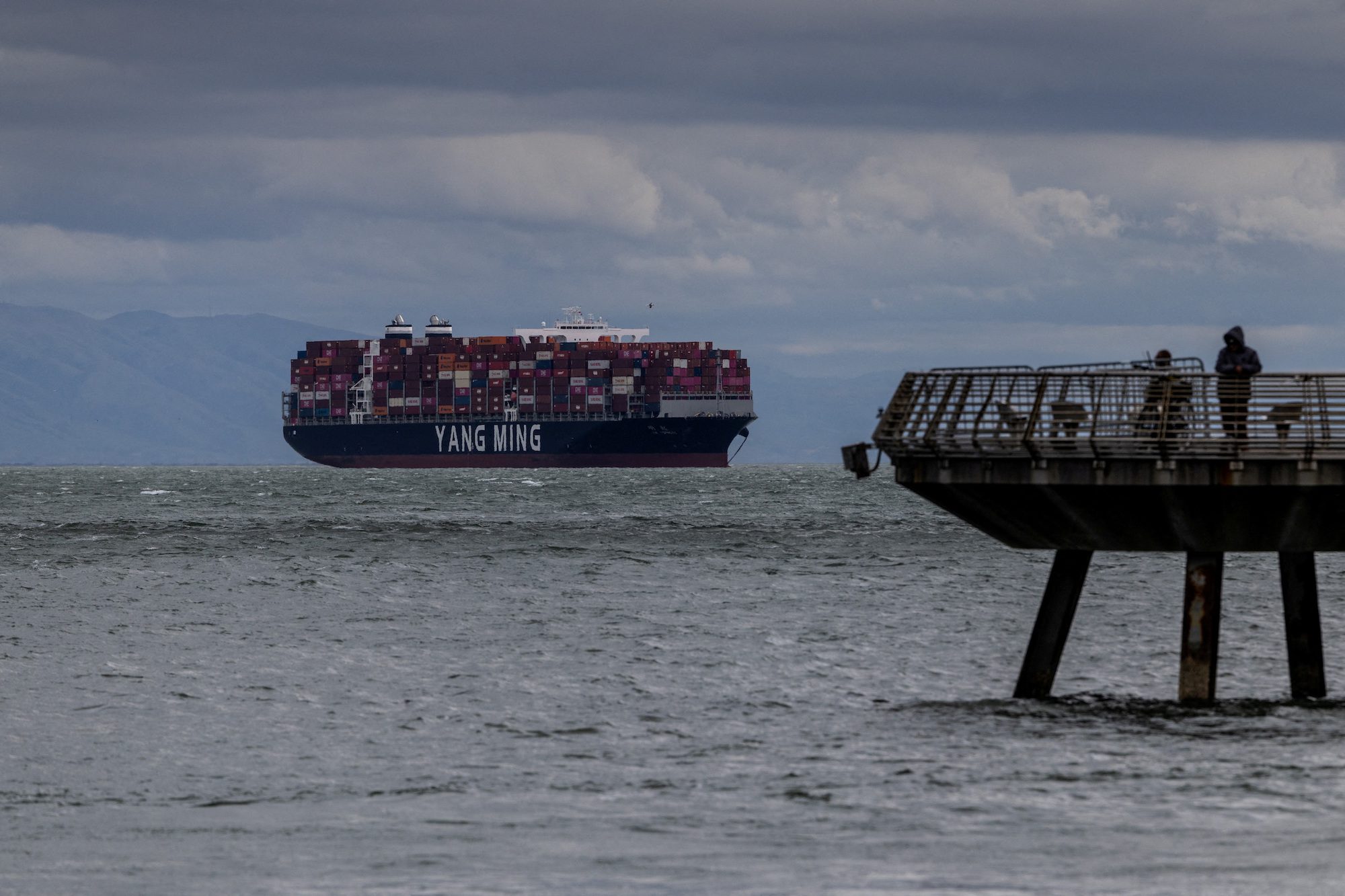 FILE PHOTO: A cargo ship full of containers is seen at the port of Oakland as trade tensions escalate over U.S. tariffs, in Oakland, California