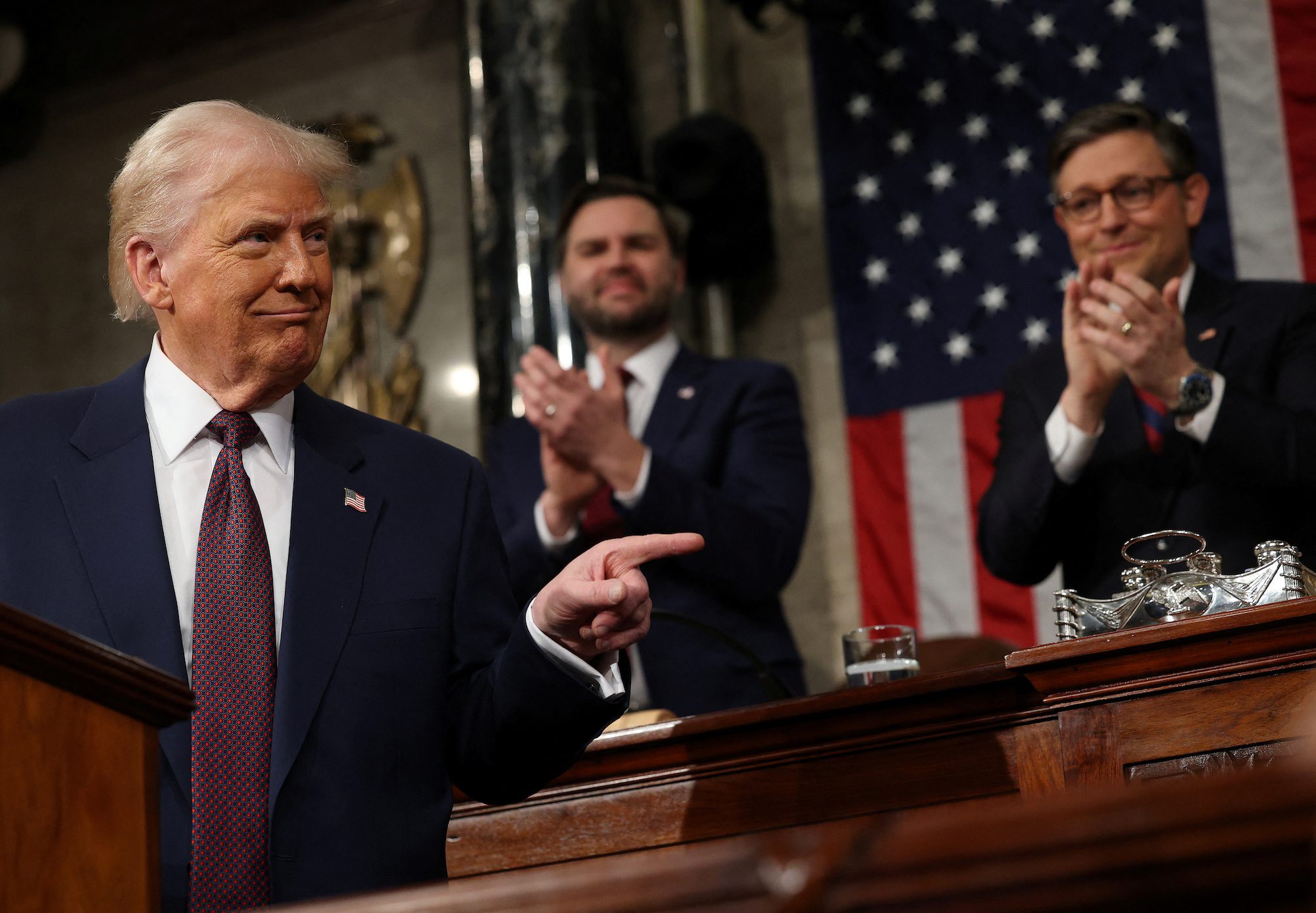 U.S. Vice President JD Vance and Speaker of the House Mike Johnson (R-LA) applaud as U.S. President Donald Trump addresses a joint session of Congress at the U.S. Capitol on March 04, 2025 in Washington, DC. Win McNamee/Pool via REUTERS