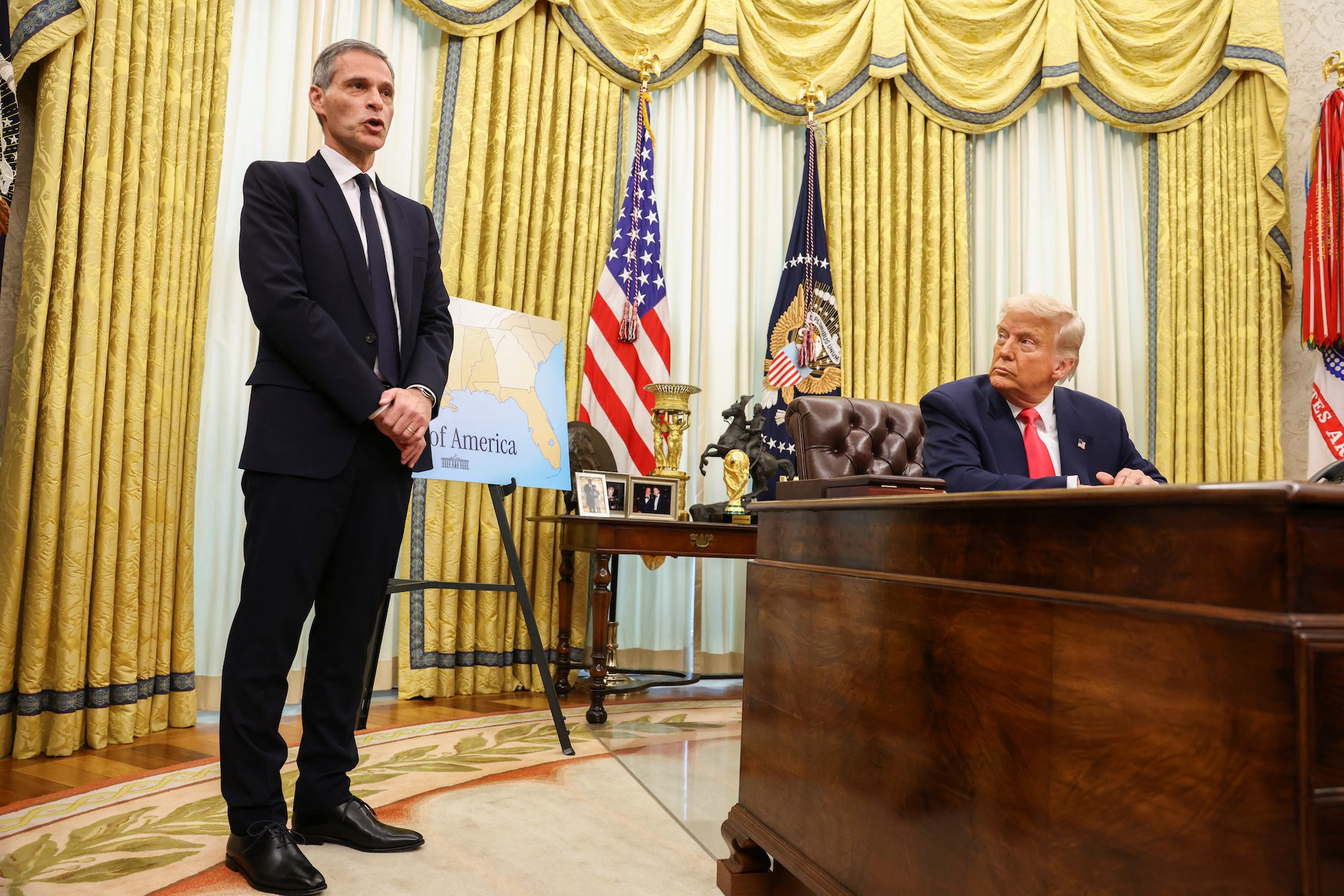 U.S. President Donald Trump listens as Rodolphe Saade, CEO pof CMA CGM Group, speaks in the Oval Office, at the White House in Washington, D.C., U.S. March 6, 2025