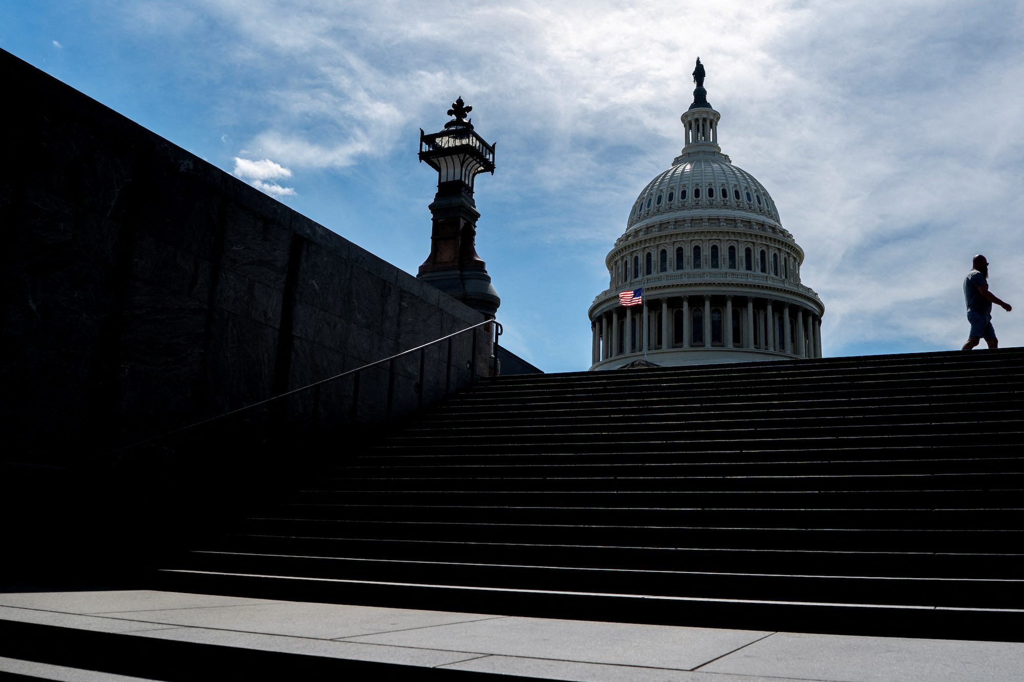 FILE PHOTO: A person walks near the U.S. Capitol in Washington