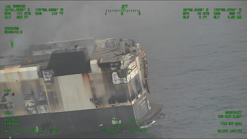 A Coast Guard C-130J Super Hercules aircrew from Coast Guard Air Station Kodiak conducts an overflight of a fire aboard the cargo vessel Morning Midas 