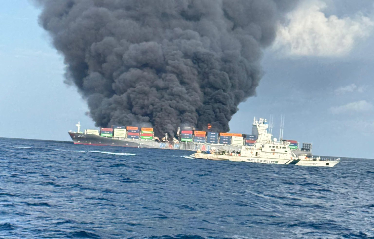 Smoke and flames coming from the Wan Hai 503 off the coast of Kochi, India
