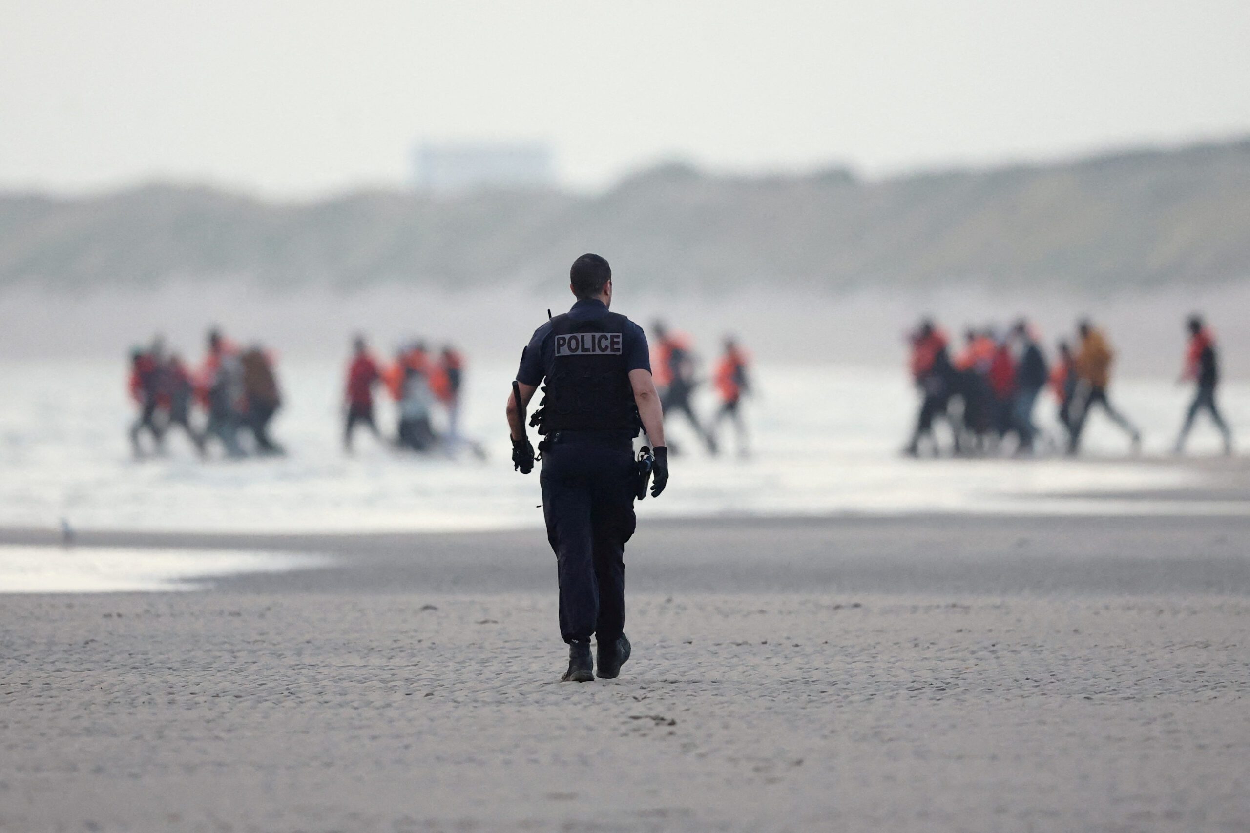 Migrant dinghy heads off the French coast to cross the English channel