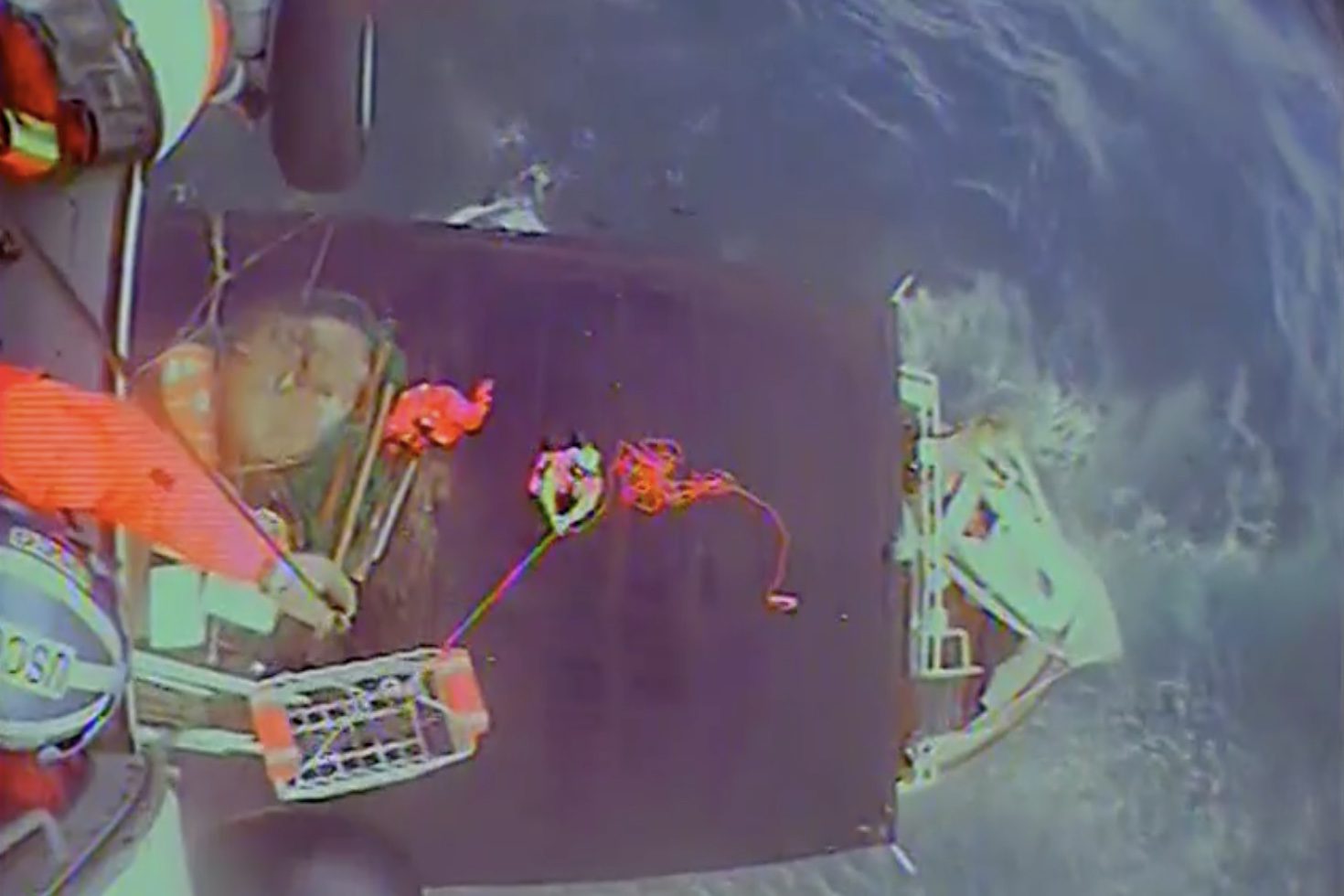 A Coast Guard MH-60 Jayhawk helicopter aircrew from Coast Guard Air Station Kodiak, Alaska, rescues four people from the tug vessel Sea Ranger, which was taking on water approximately 130 miles south of Cordova