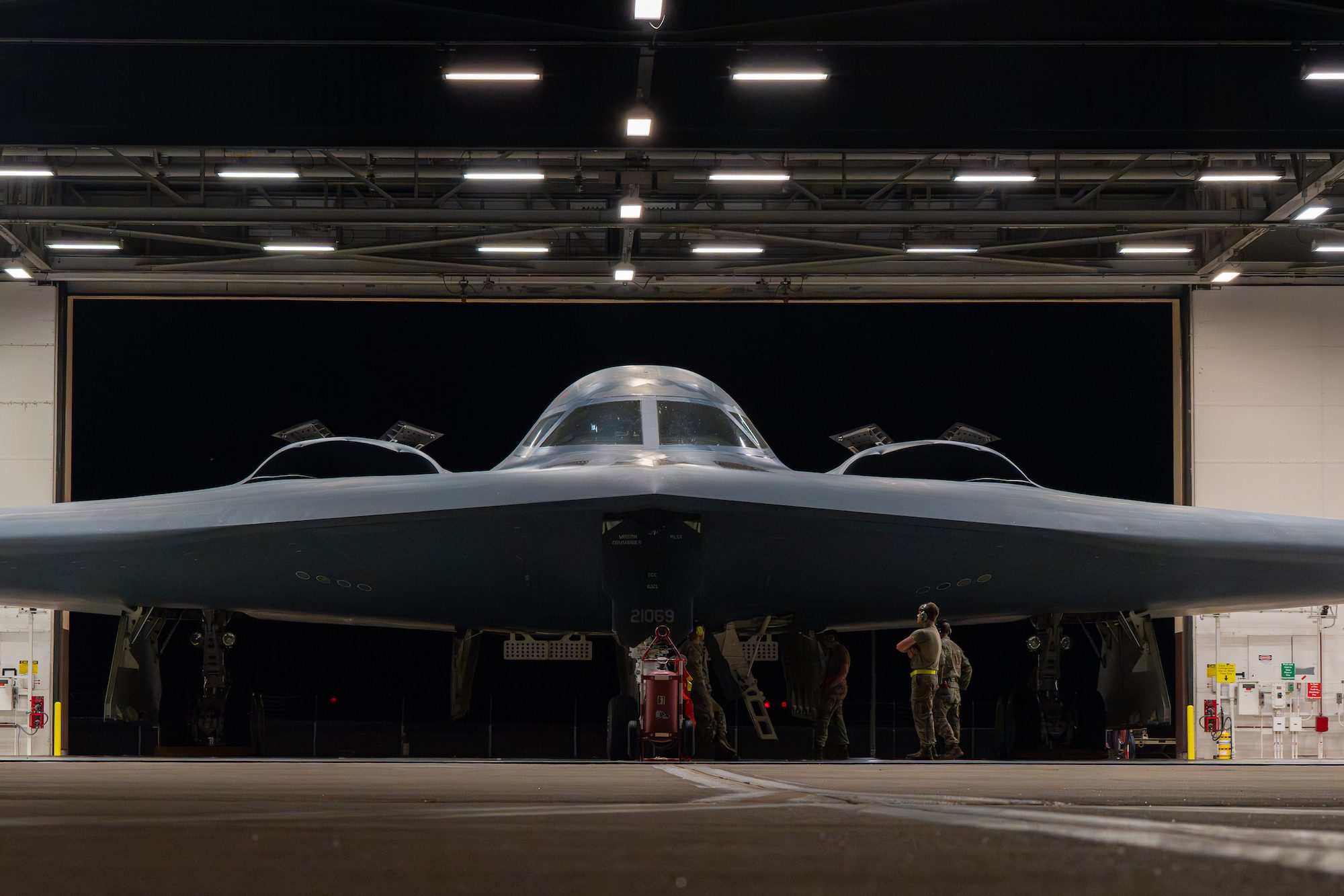 U.S. Airmen assigned to the 393rd Bomber Generation Squadron prepare a B-2 Spirit aircraft carrying Joint Direct Attack Munitions for departure at Whiteman Air Force Base