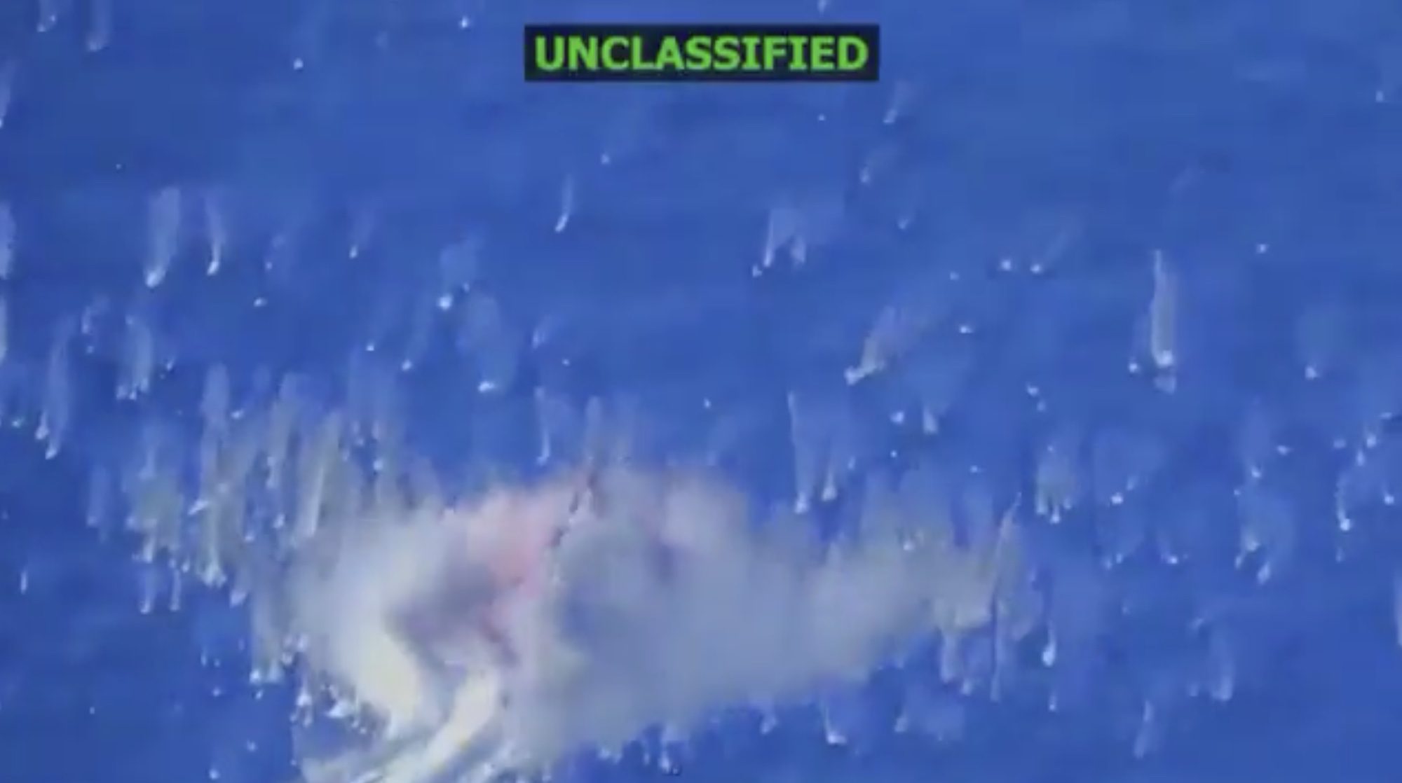 A screenshot of video shared on X by "Secretary of War" Pete Hegseth showing a deadly strike on an alleged drug smuggling vessel near Venezuela