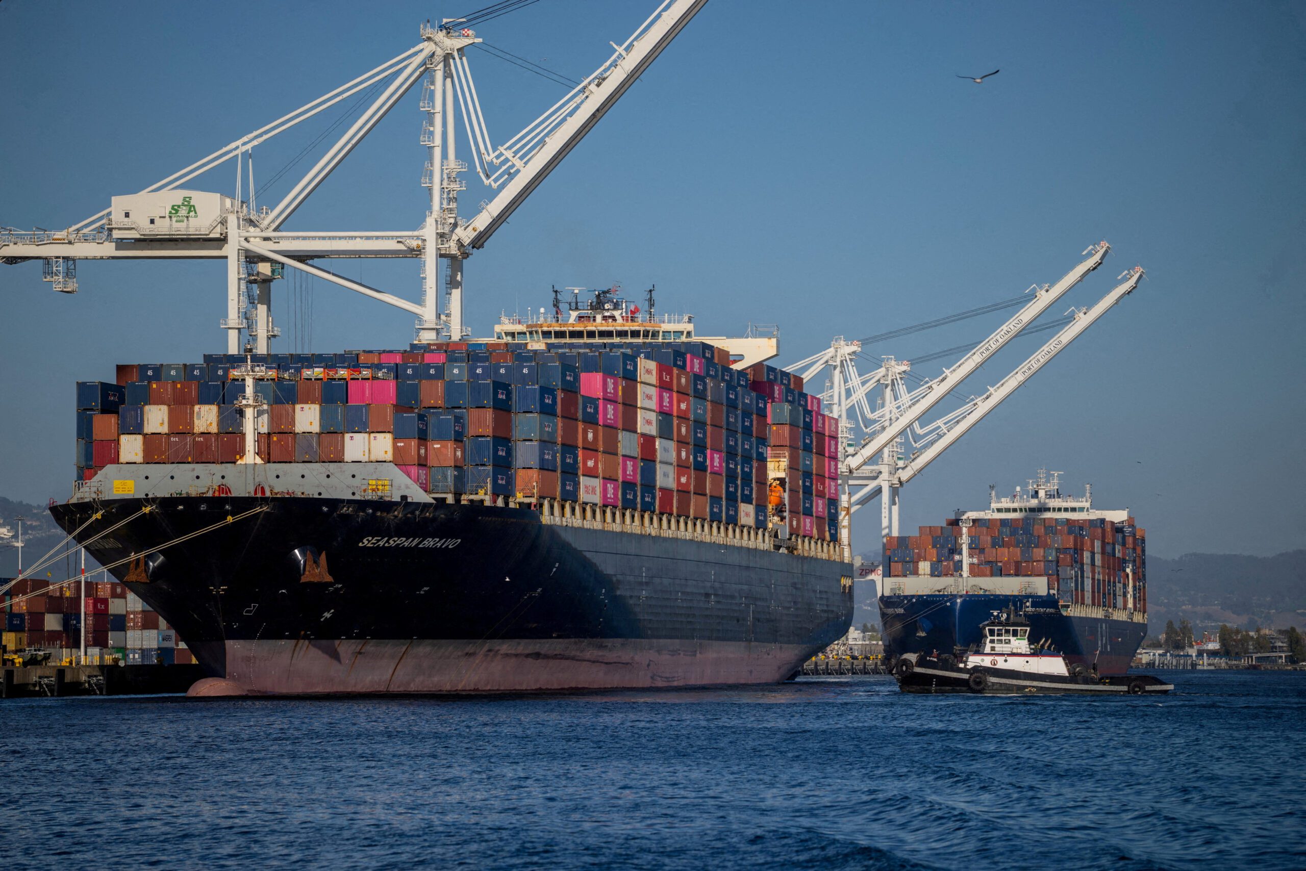 A cargo ship full of shipping containers is seen at the port of Oakland, California
