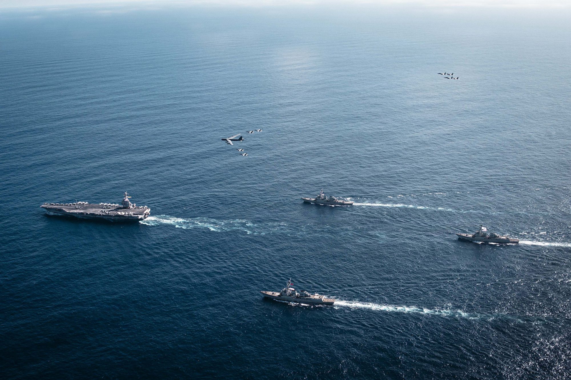 The U.S. Navy’s Gerald R. Ford Carrier Strike Group, including the flagship USS Gerald R. Ford (CVN 78), left, USS Winston S. Churchill (DDG 81), front, USS Mahan (DDG 72), back, USS Bainbridge (DDG 96), and embarked Carrier Air Wing Eight F/A-18E/F Super Hornets