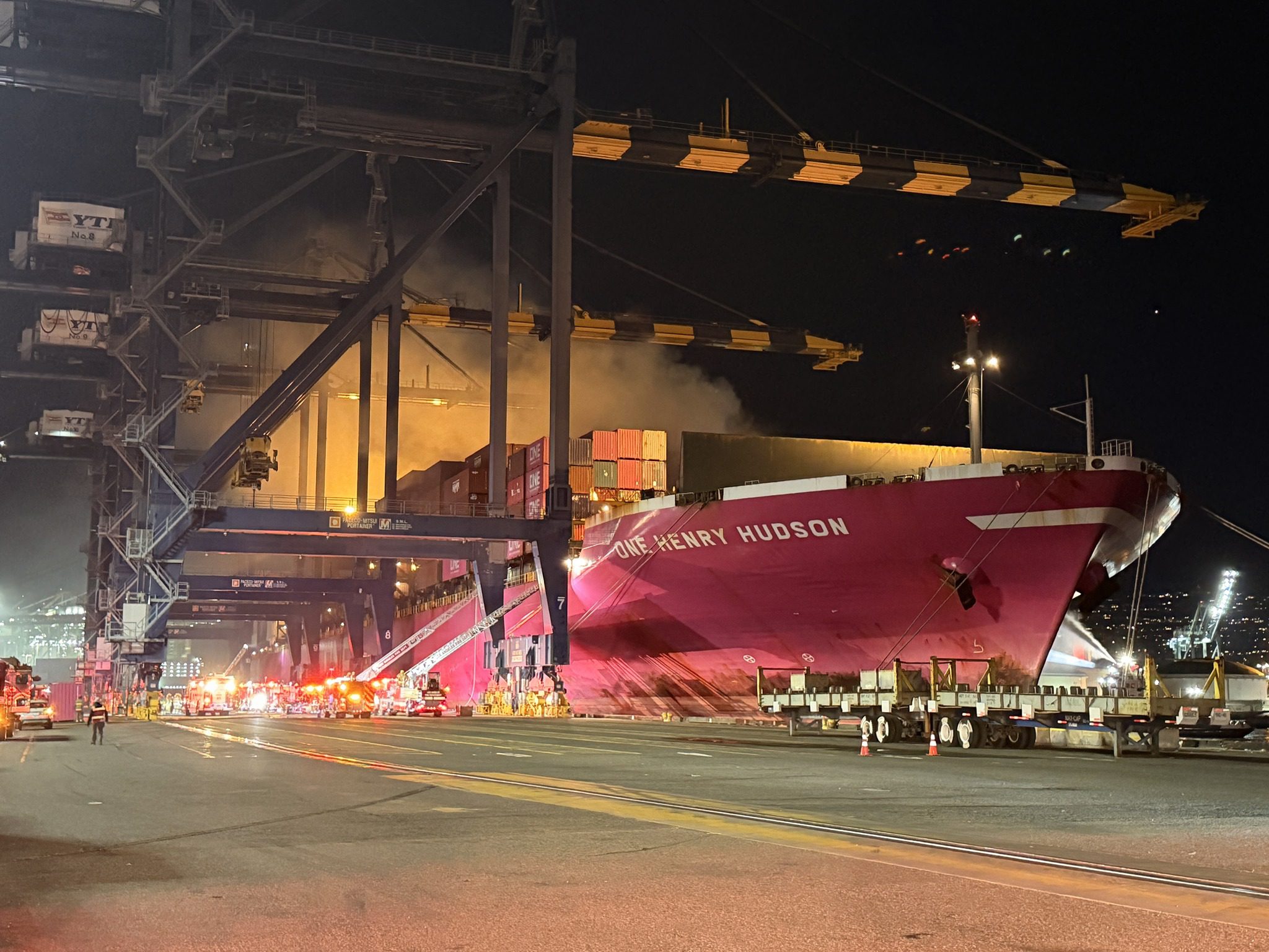 A fire burns on the M/V One Henry Hudson berthed at the Port of Los Angeles