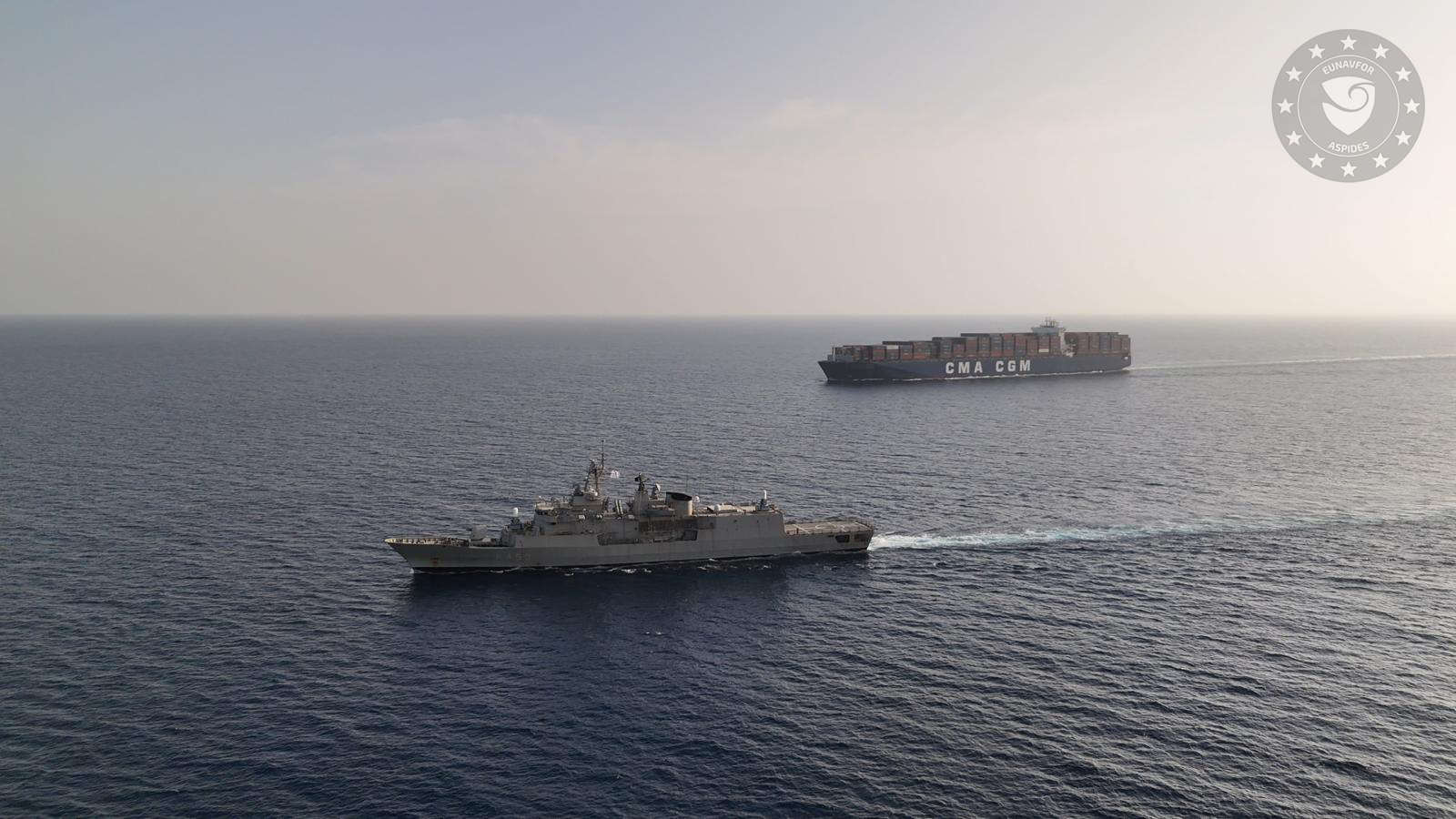 A CMA CGM containership transits the South Red Sea under escort by a EUNAVFOR warship