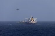 A U.S. military helicopter flies over the Panama-flagged Centuries, which was intercepted by the U.S. Coast Guard, days after U.S. President Donald Trump announced a "blockade" of all sanctioned oil tankers