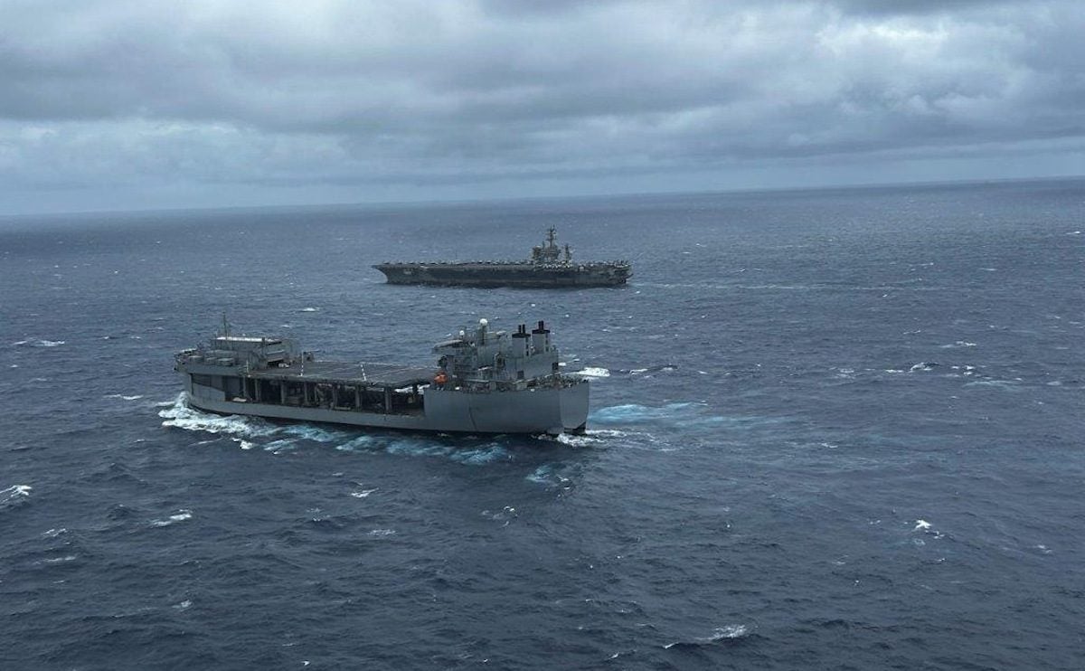 The USS Miguel Keith (ESB 5) sails alongside a CVN in an undisclosed location