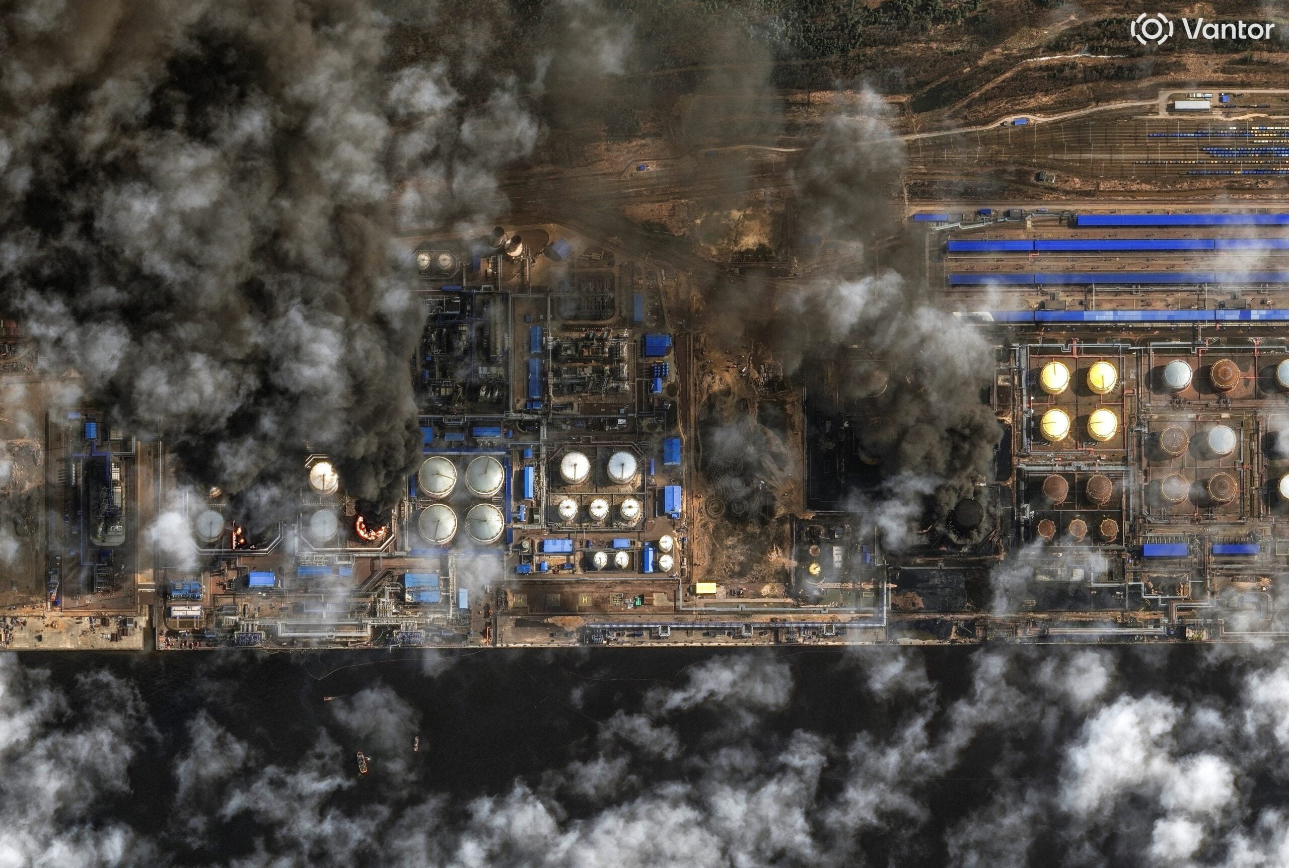 A satellite near-infrared image shows smoke rising from oil storage tanks at Russia's Baltic Sea port of Ust-Luga, which was struck multiple times in Ukrainian attacks, in Ust-Luga