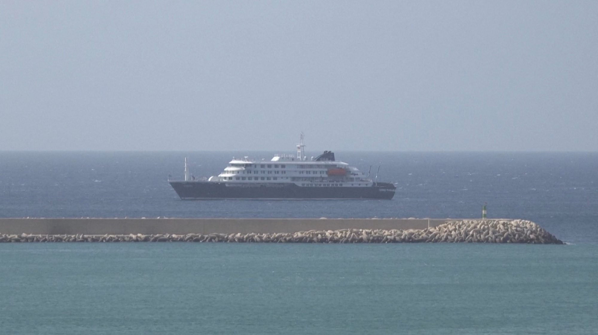 Cruise ship MV Hondius docks off Cape Verde port, as passengers were not allowed off the ship, while health authorities investigated suspected cases of hantavirus aboard the vessel, in Praia Port, Cape Verde