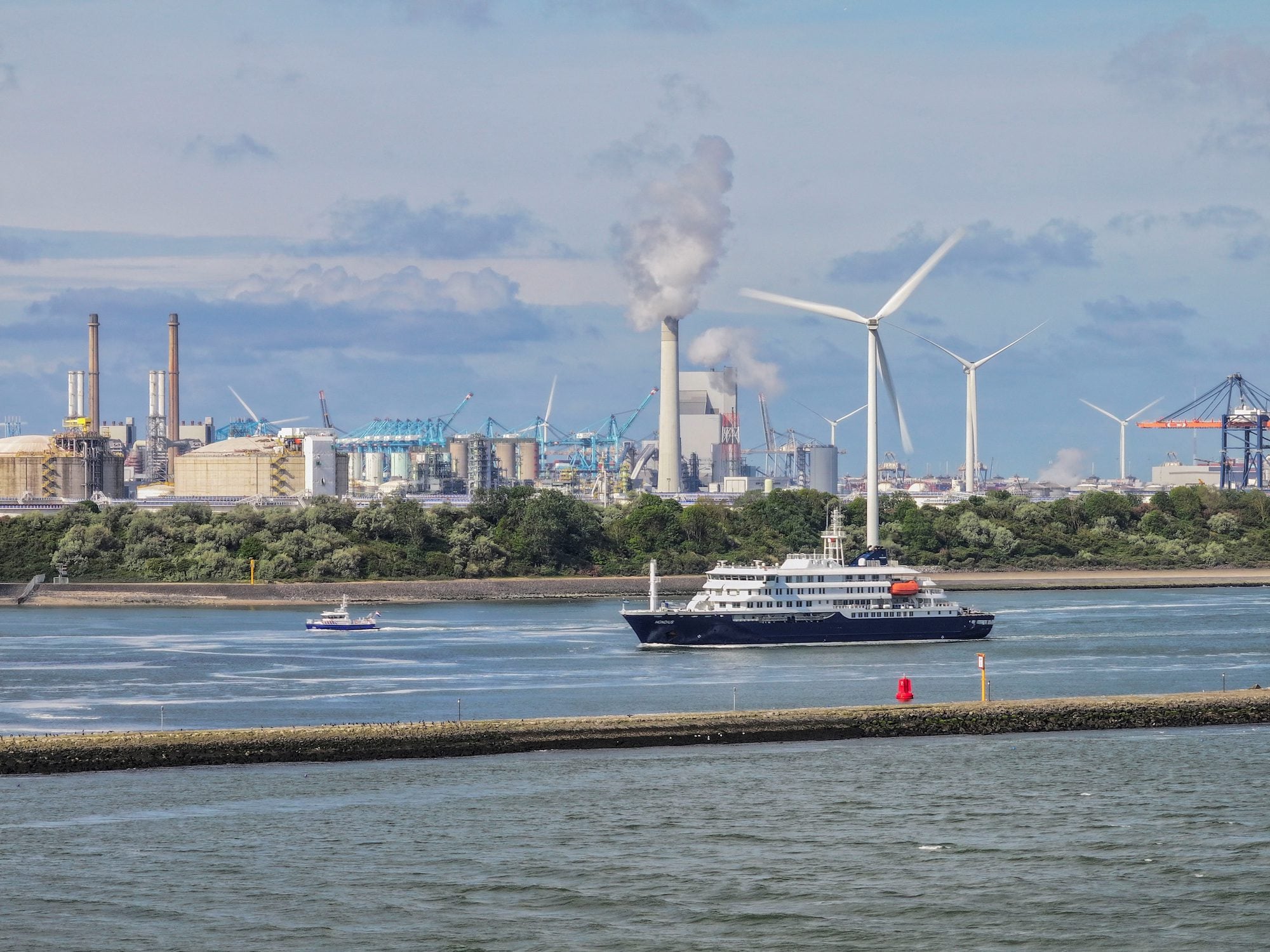 A drone view shows a vessel sailing near the cruise ship MV Hondius as it arrives for disinfection at the Port of Rotterdam,
