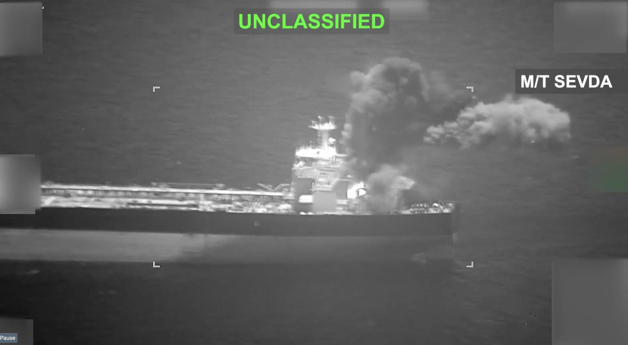 Black-and-white thermal image showing the Iranian-flagged tanker M/T Sevda at sea with smoke rising from the vessel after a reported U.S. strike in the Gulf of Oman. The image includes the labels “MT SEVDA” and “UNCLASSIFIED.”
