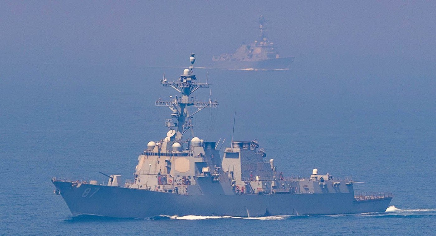 U.S. Navy guided-missile destroyers transit the Strait of Hormuz during heightened tensions with Iran in a photo released by U.S. Central Command on May 7, 2026