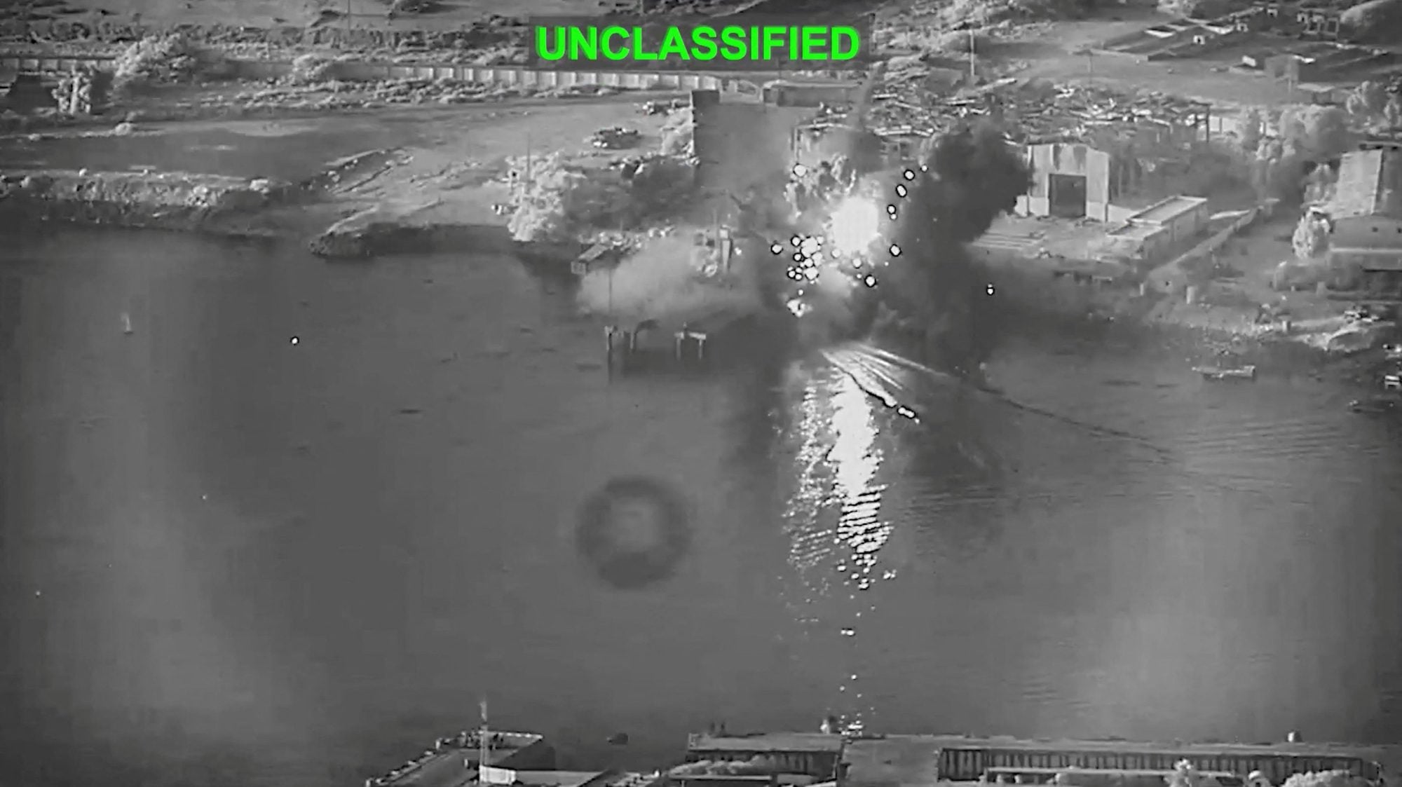 Smoke rises after a U.S. one-way attack surface drone reached its target, a submarine and ship maintenance facility according to U.S. Central Command, in Bandar Abbas, Iran, in this screengrab taken from a video, which was released July 13, 2026