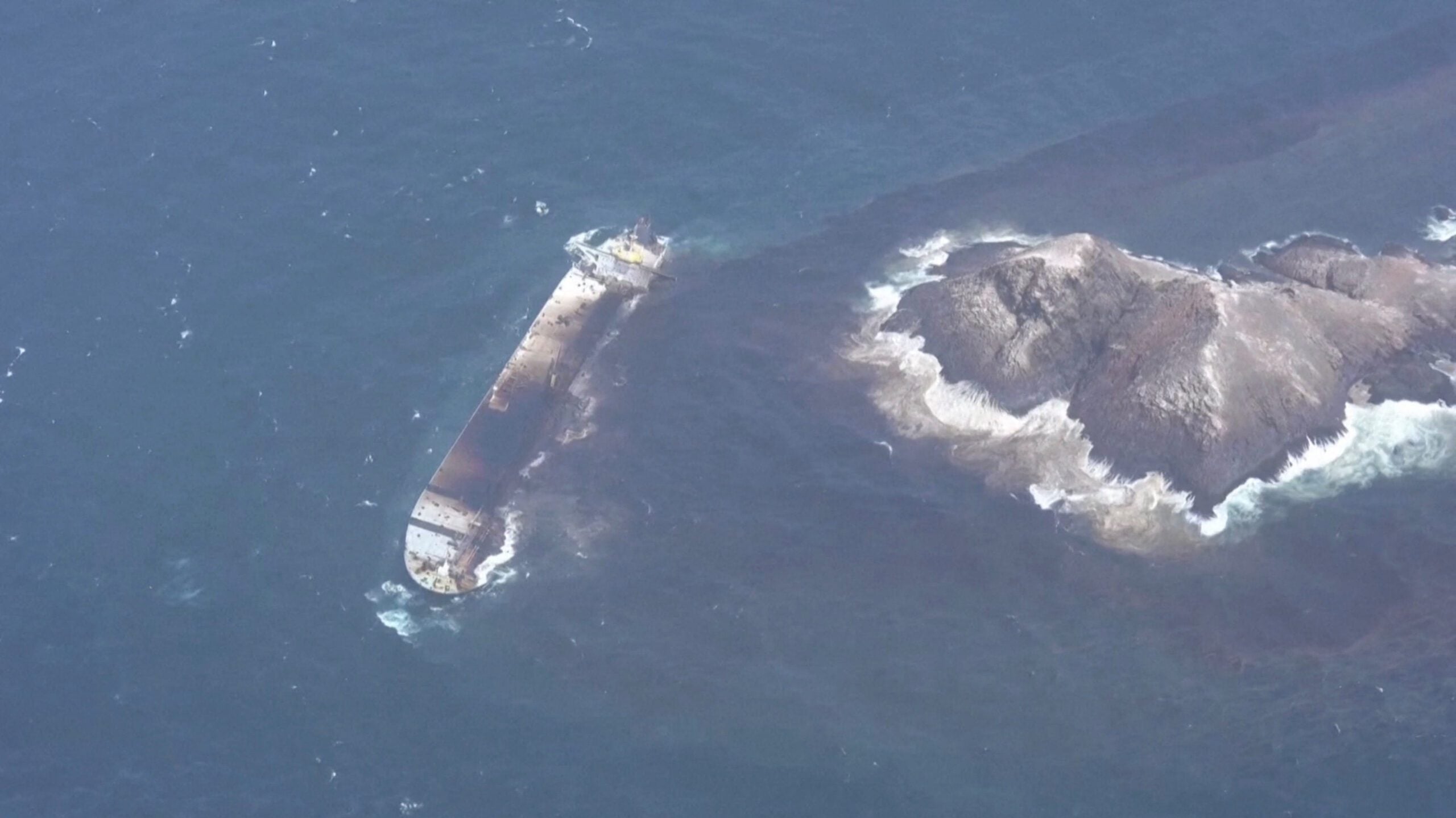 Aerial view of oil spilling from the oil tanker Caroline Bezengi into the water, off Al-Qibliyyah island, Hallaniyat Group Of Islands