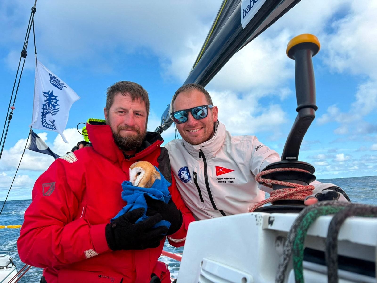 Sergeant Petherbridgeand Captain Court with rescued barn owl, Little Regina, aboard Fujitsu British Soldier