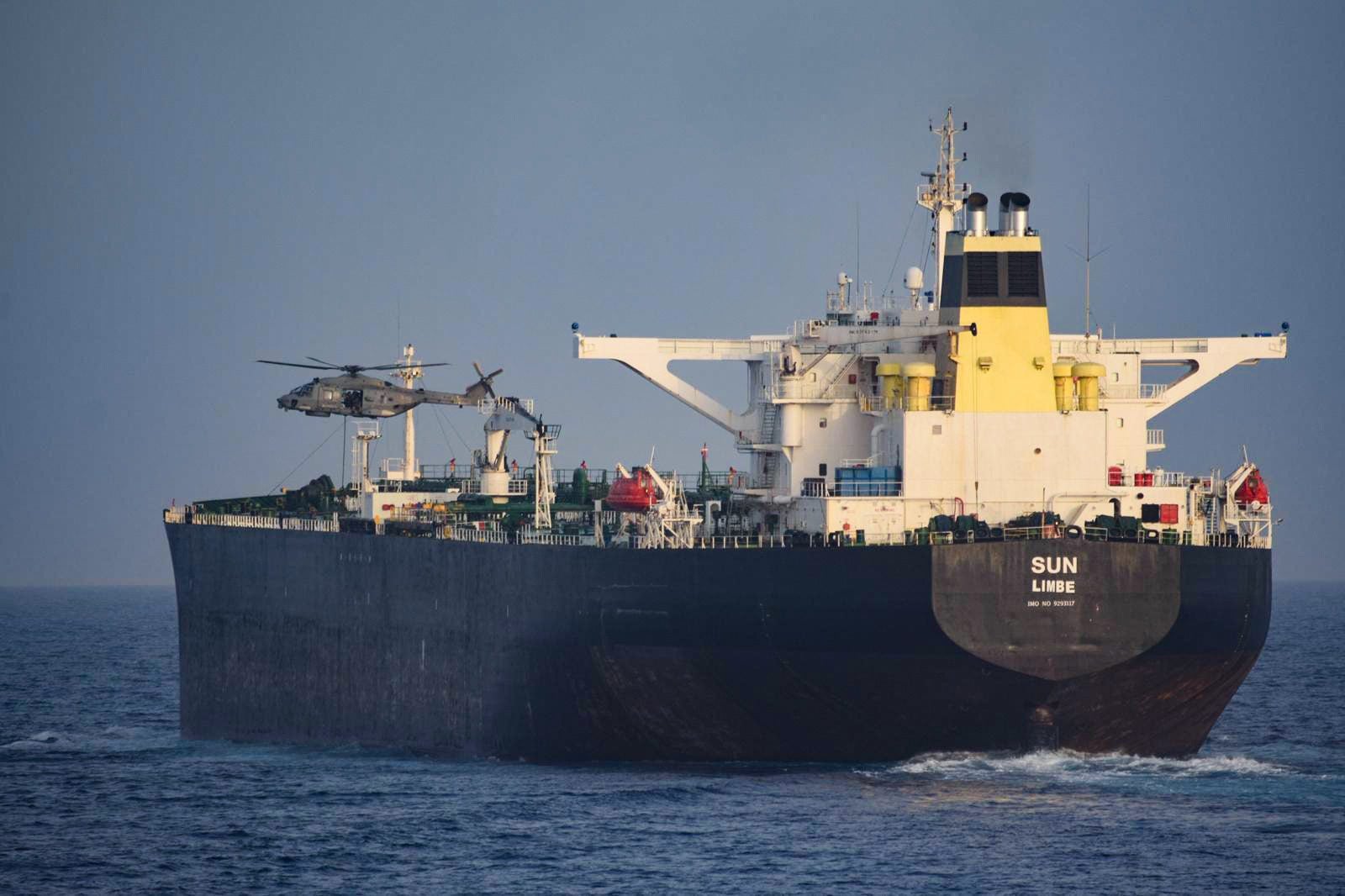 EUNAVFOR MED IRINI helicopter alongside the oil tanker Sun during a flag-verification boarding in the Mediterranean.