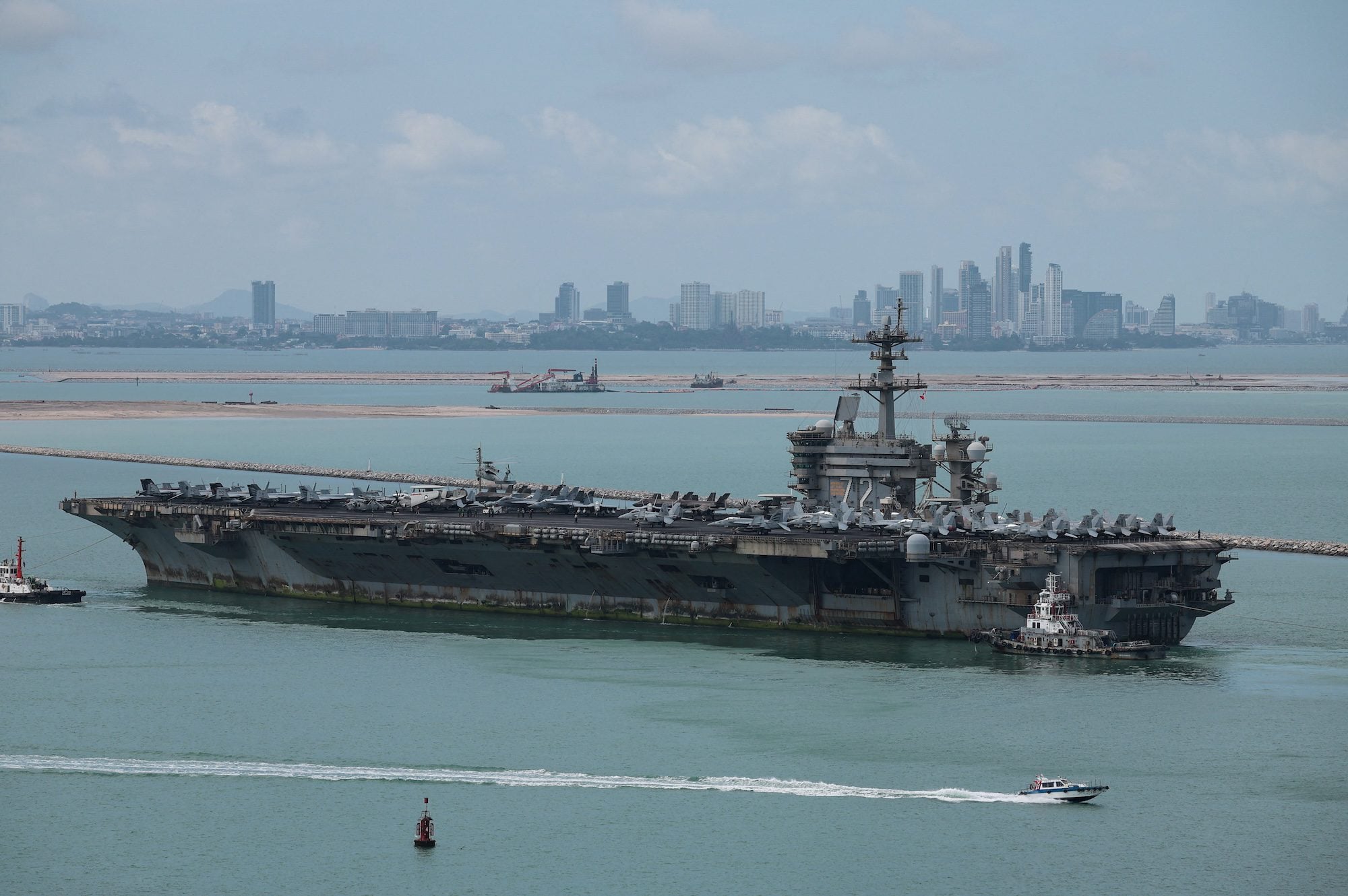 The U.S. Navy Nimitz-class aircraft carrier USS Abraham Lincoln sails toward Laem Chabang Port before docking