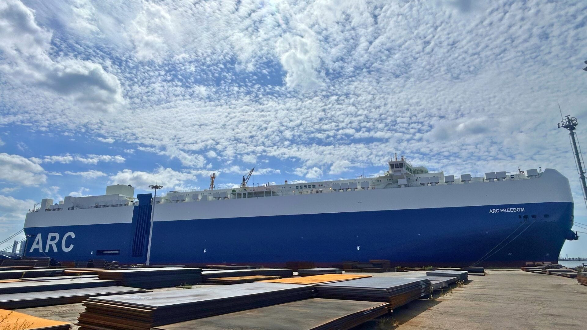 ARC Freedom, a U.S.-flagged large car and truck carrier, docked alongside a terminal after reflagging.