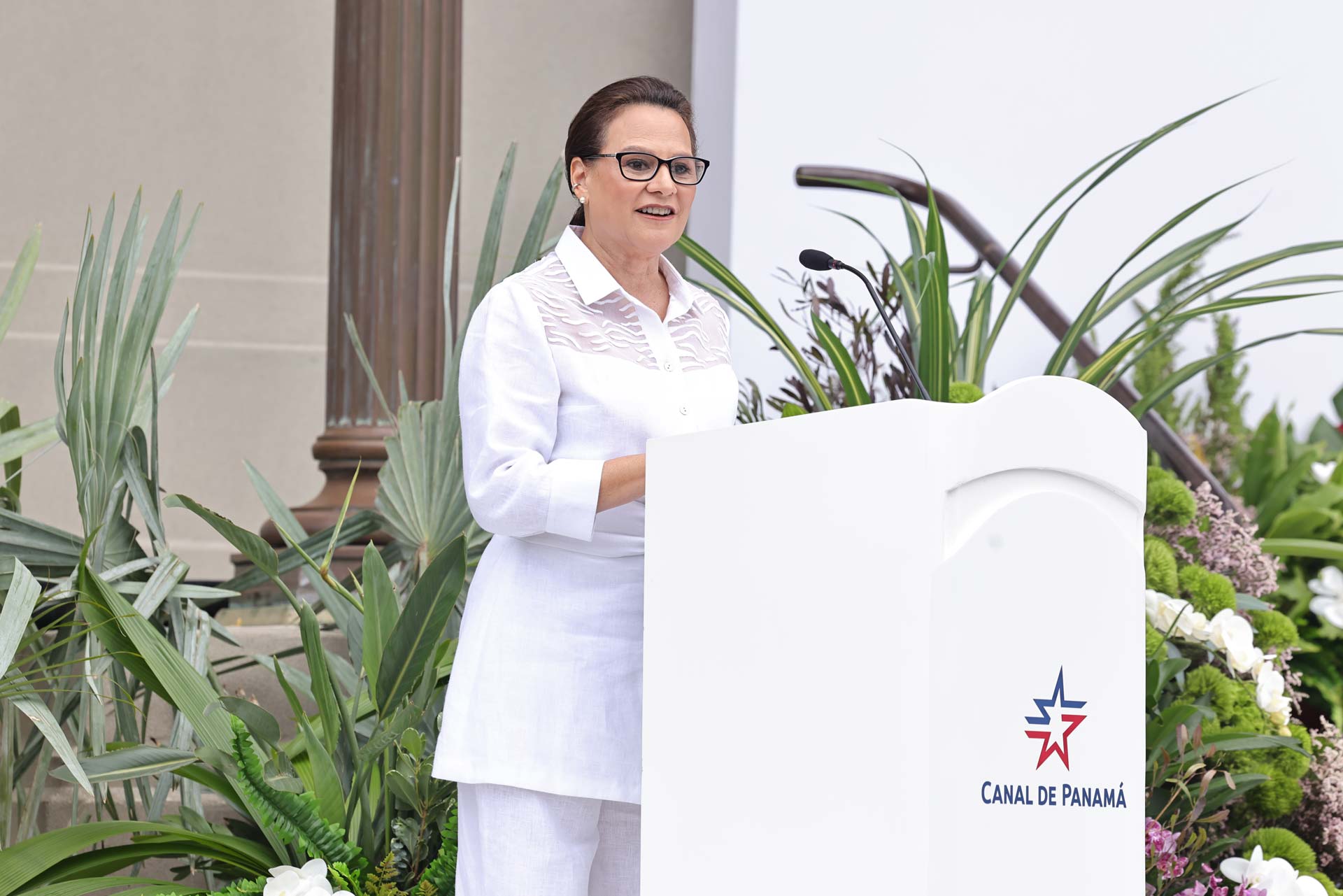 Ilya Espino de Marotta speaks at a podium during her inauguration as Administrator of the Panama Canal in Panama City.
