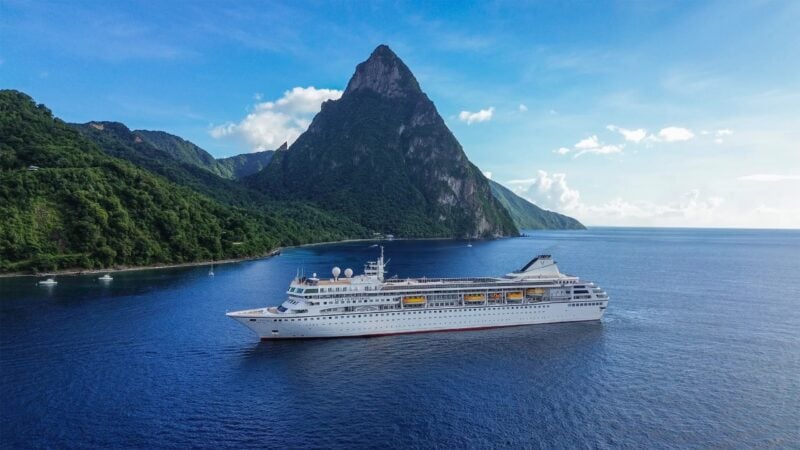The Villa Vie Odyssey at anchor off St. Lucia in the Caribbean, in a company photo. The ship is the former Fred. Olsen liner Braemar, built in 1993.