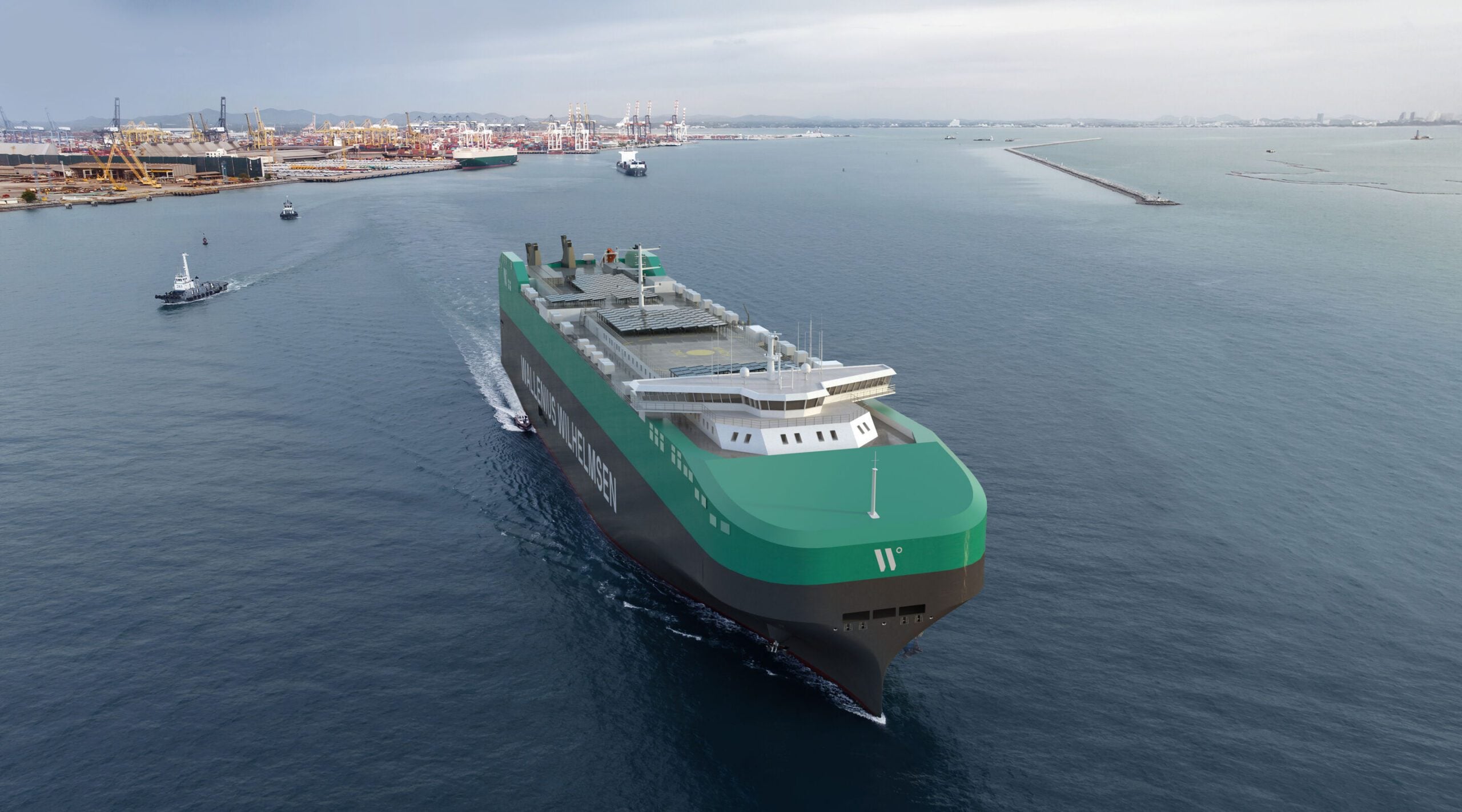 Rendering of a green-and-black Wallenius Wilhelmsen Shaper Class car carrier underway near a shipyard, with cranes, tugboats and port facilities in the background.